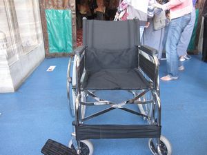 Everyone walking will have to take off their shoes to enter.  Wheelchair users will have to transfer to this wheelchair.