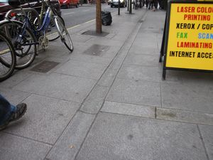 These small grooves run down the middle of many sidewalks to help drain rainwater.  Most of the sidewalks in Dublin are wheelchair accessible like this one.