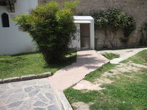 On the left side of the third courtyard there is a wheelchair accessible restroom that is sort of hidden.