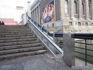 The bridge at the entrance has a wheelchair lift. Press the button to get the attention of a staff member.