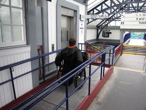 Train stations may have elevators that lead to tunnels or overhead walkways to cross the train tracks.