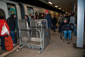 More common than ramps, most stations use a lift to get wheelchair users onto the train.